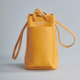 bucket bag soft leather outside pocket shoulder strap yellow orange