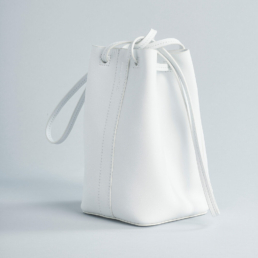 bucket bag soft leather outside pocket shoulder strap white
