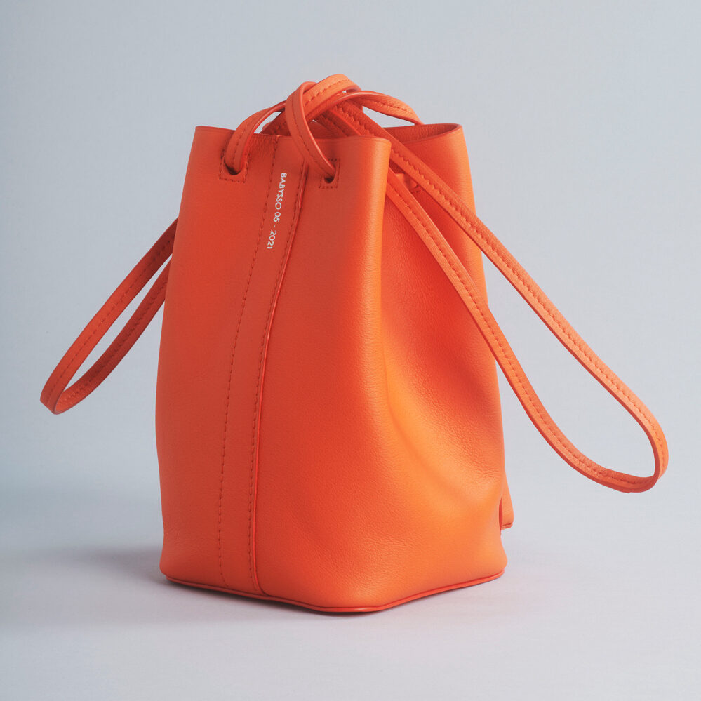 soft leather bucket bag with outside pocket and shoulder strap