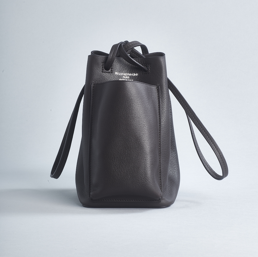 soft leather bucket bag with outside pocket and brown shoulder strap