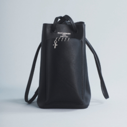 bucket bag soft leather outside pocket shoulder strap black piercing