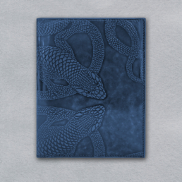 compact ticket holder in glazed leather with hand embossed lizard motif in navy blue